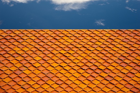 Red roof and cloudy sky backgroundの写真素材