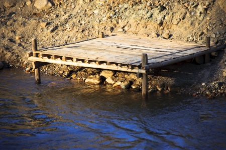 Light on bamboo in riverの写真素材