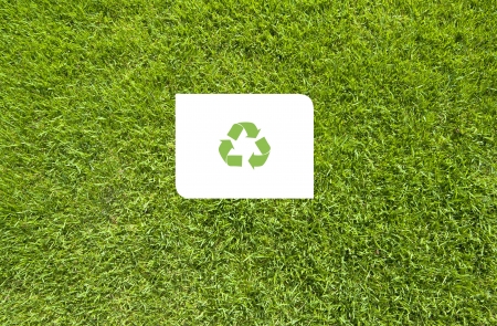 Recycle on Green grass,  texture backgroundの写真素材