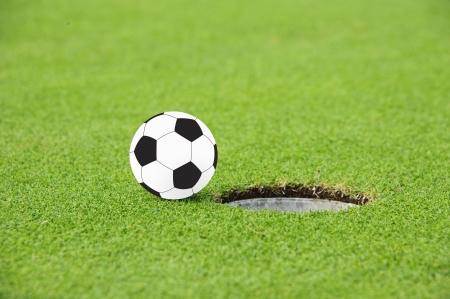 Football on Edge of Hole の写真素材
