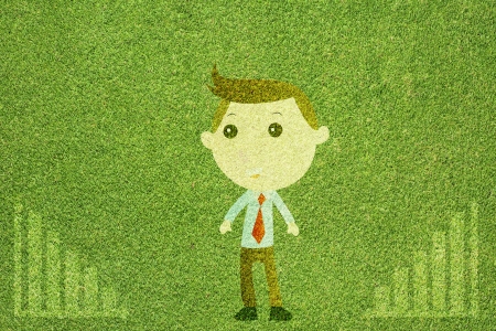 Business man on green grass texture and  backgroundの写真素材
