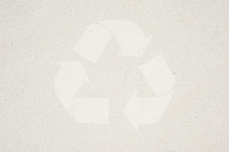 Recycle icon on sand background and texturedの写真素材