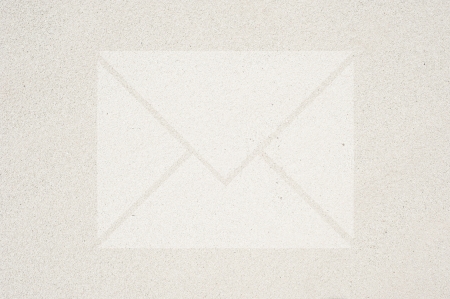 Mail icon on sand background and texturedの写真素材