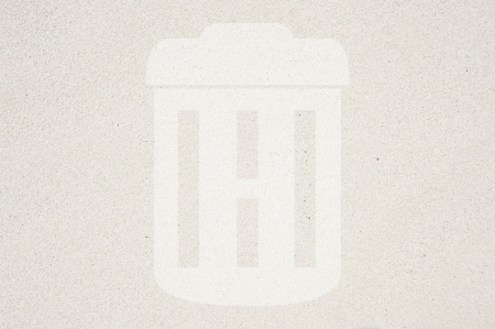 Trash icon on sand background and texturedの写真素材