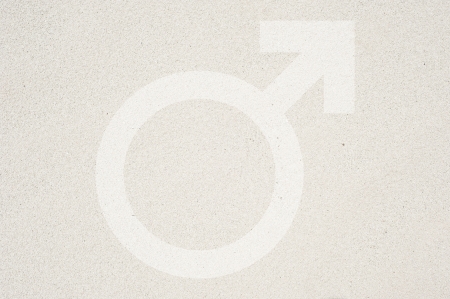 Gender man symbol icon on sand texture and background の写真素材