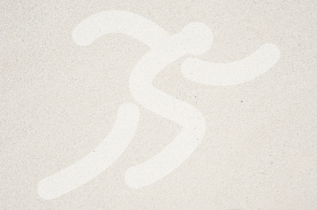 Sport running icon on sand texture and background の写真素材