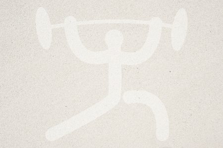 Sport weight icon on sand texture and background の写真素材