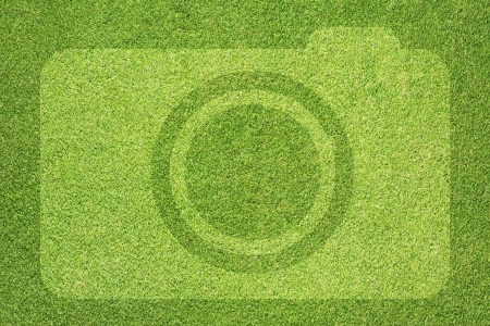 Camera icon on grass backgroundの写真素材