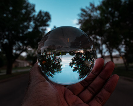 View of the road upside down through a lens ball.の写真素材