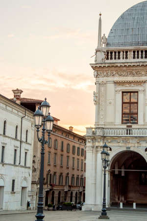 Brescia, Italy - 09 03 2018: Panoramic view of Loggia palace ( palazzo della loggia) of Brescia square during sunset at the end of the summer.のeditorial素材