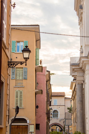 Traditional street or alley in Brescia, a italian north city at the sunset with blue clear sky and...