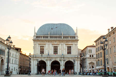 Brescia, Italy Panoramic view of Loggia palace ( palazzo della loggia) of Brescia square during sunset at the end of the summer.のeditorial素材