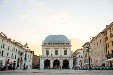Brescia, Italy Panoramic view of Loggia palace ( palazzo della loggia) of Brescia square during sunset at the end of the summer.のeditorial素材