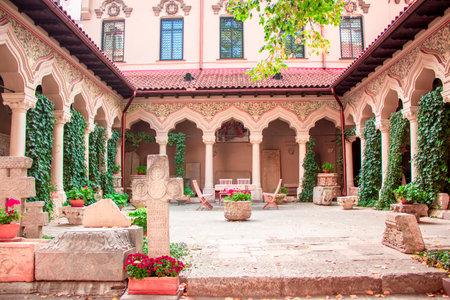 Bucharest, Romania - 10 12 2018 Cross and tombstone courtyard in Stavropoleos orthodox Monastery Church in Bucharest, Romaniaのeditorial素材