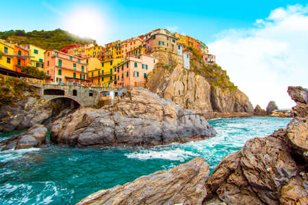 Manarola in cinque terre on the mountain near mediterranean sea in liguria - Italy. Sunny cloudy sky. Traditional italian architectureの写真素材