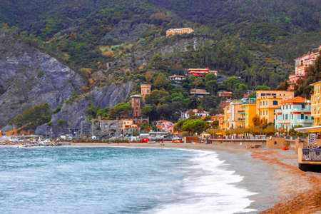 Monterosso al mare, cinque terre in Liguria region, Italy. Inspirational sunset sky over the calm mediterranean sea and rockの写真素材