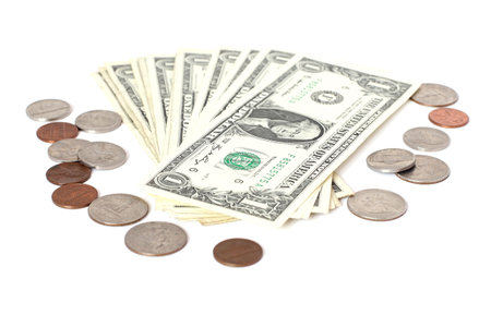 US cents andon US dollar banknotes on a white background