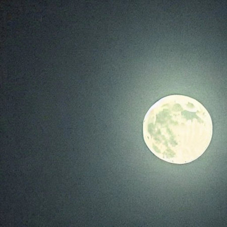 Full moon in the night sky, showing the beauty of the nature.の素材