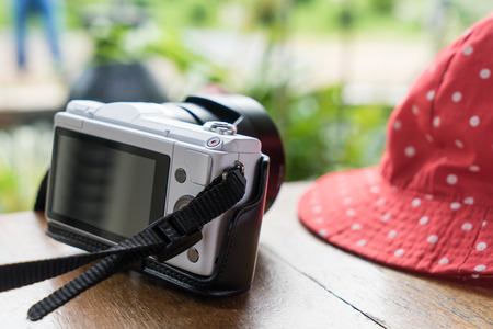 Girly Hat and white camera for chick travel summer vacation background.の写真素材