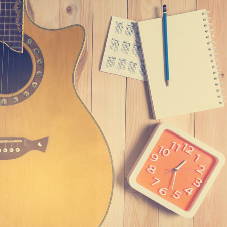 Guitar with Blank notebook for song writing time.