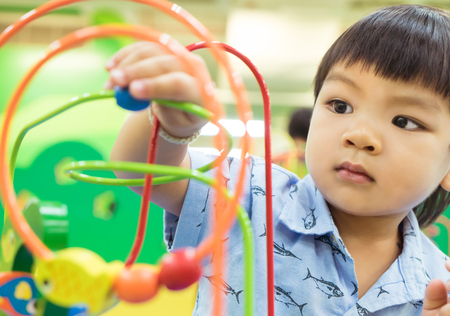Asian Baby playing with Educational toyの写真素材