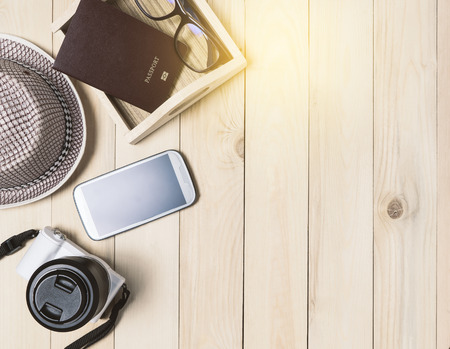 Travel items on wooden desk.の写真素材