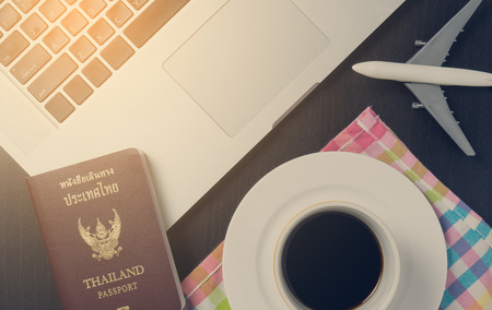 Business traveller equipments laying on desk.の写真素材