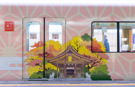 Fukuoka, Japan - March 19, 2016: The pink decorated train that run from Tenpin station to Dazaifu station.のeditorial素材