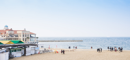 Fukuoka, Japan - March 19, 2016: Tourists are taking picture on the beachside walk of seaside momochi park.のeditorial素材