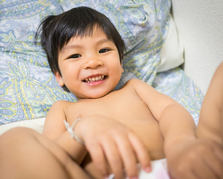 Asian boy naked wearing Diaperの写真素材