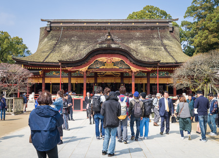 Fukuoka, Japan - March 19, 2016: Fukuoke on March 19, 2016. A large group of Chinese tourists are walking in to Dazaifu Shrine.のeditorial素材