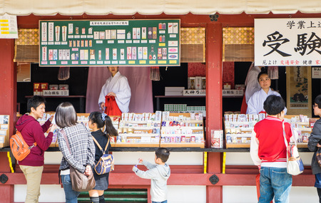 Fukuoka, Japan - March 19, 2016: Fukuoka on March 19, 2016. Hundreds of Chinese tourists are enter the Dazaifu shrine.のeditorial素材