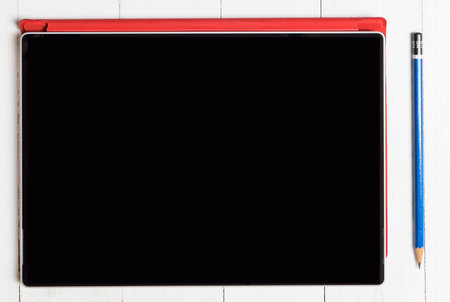 Tablet with real pencil. Blank screen.