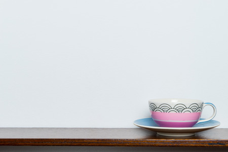 Tea or Coffee cup in pastel tone on wooden table with copy spaceの写真素材