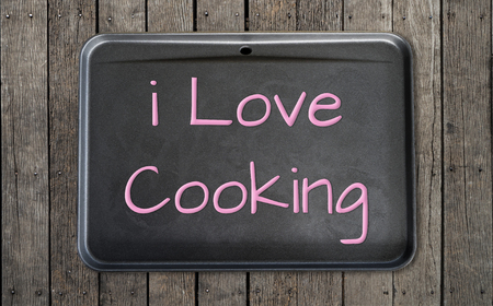 I love cooking on black pan on wooden rustic tableの写真素材