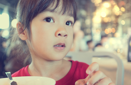 Asian Girl having breakfast setの写真素材