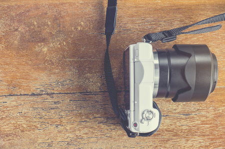 Mirrorless Camera on wooden tableの写真素材