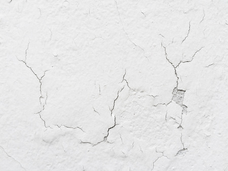 cracked white concrete cement wall texture background.の写真素材