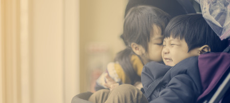 Asian Baby Sister kissing Baby Brotherの写真素材