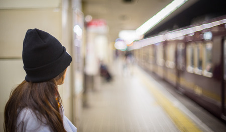 Asian Teenager waiting for Subwayの写真素材