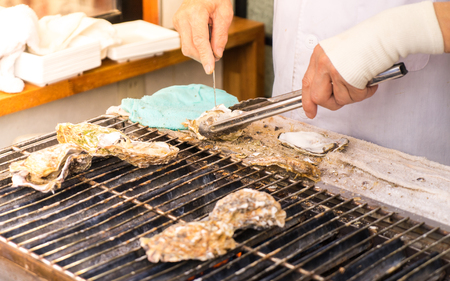 Cooking Japanese grilled Oystersの写真素材