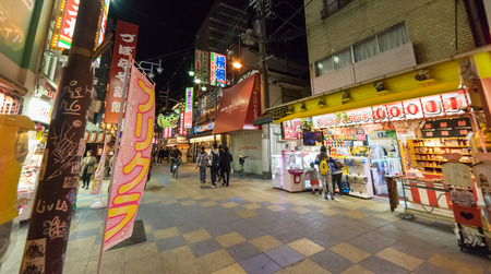 Osaka, Japan - March 11, 2016: People walking around Shinsekai street looking for good restaurants.のeditorial素材