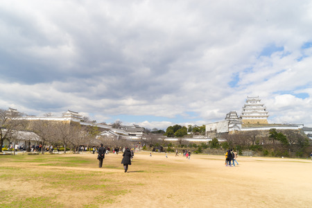 Himeji, Japan - March 12, 2016: Tourist are walking to Himeji castle through the front garden.のeditorial素材