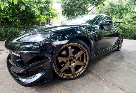 Bangkok, Thailand - September 4, 2016: A Mazda RX8 is wearing Volk Rays TE37 Golden 18 inches Rim.のeditorial素材