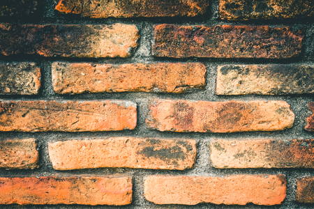 Orange weathered Rustic Brick closed up for texture background.の写真素材