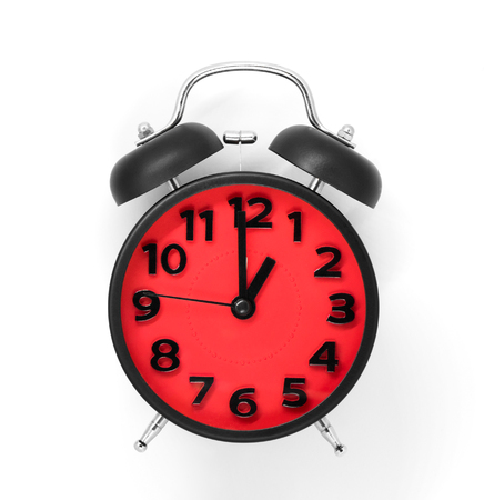 red clock face pointing at 1:00 on white background.の写真素材