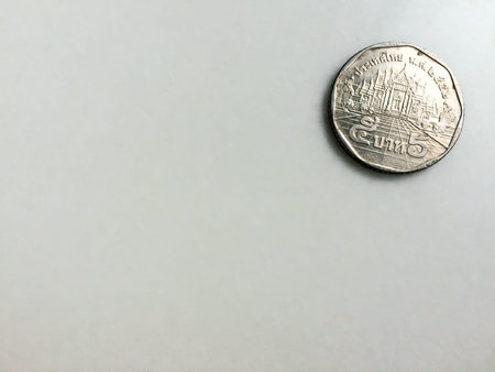 Thai Five baht coin on marble table with copy space