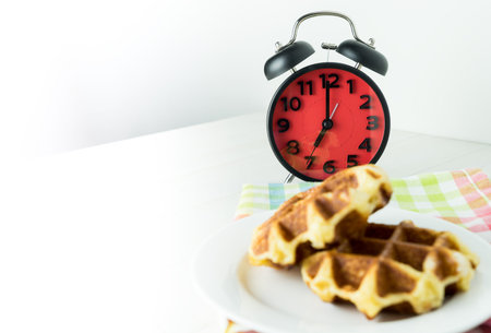 Honey Waffle for breakfast on white table with copy space
