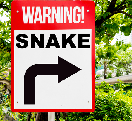 Red Snake warning sign in the forestの写真素材