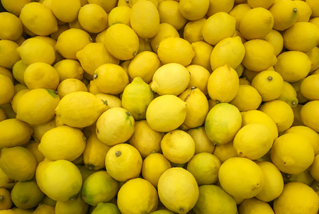 Lot of yellow lime on sale in Market in Thailand. These Lime are rare as most of Local in Thailand only using green lemon. The lime smell fresher than the lemon. Also the limes have more liquid.の写真素材
